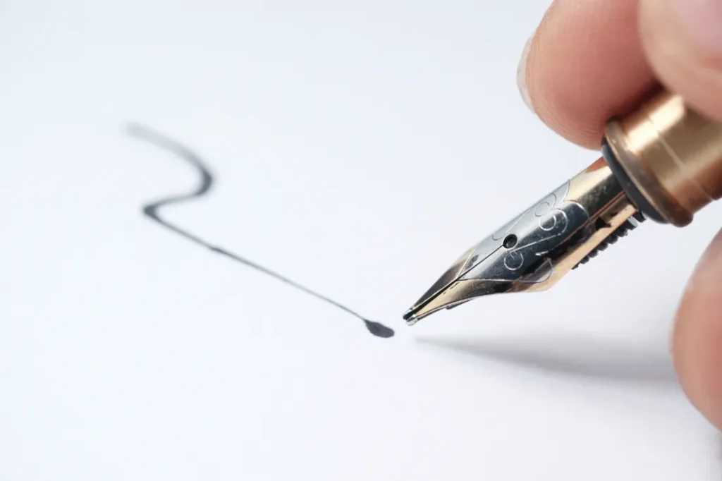 Forensic Handwriting Analysis Close-up of pen writing signature | Tian Investigations